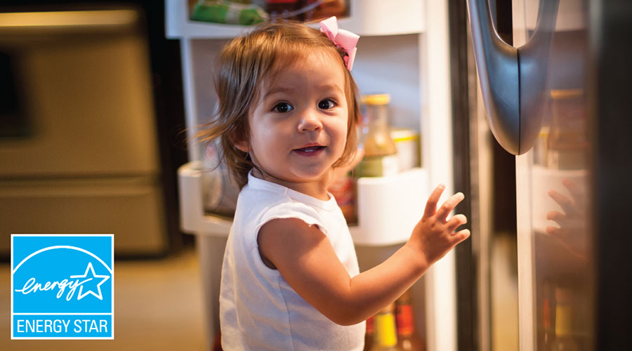 girl looking in refrigerator